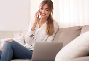 Happy Women Sitting on Couch.